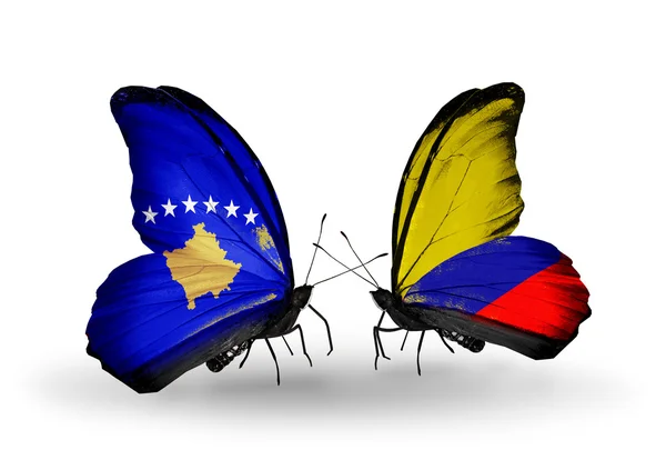 Butterflies with Kosovo and Columbia flags — Stock Photo, Image