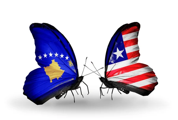Fjärilar med Kosovo och Liberia flaggor — Stockfoto