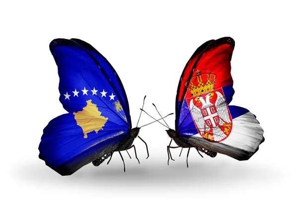 Butterflies with Kosovo and Serbia flags — Stock Photo, Image