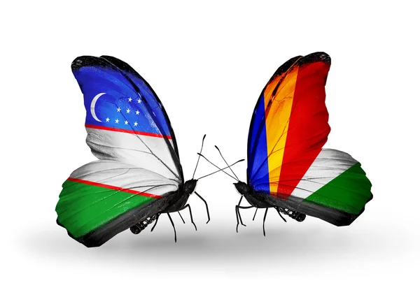 Butterflies with Uzbekistan and Seychelles flags — Stock Photo, Image