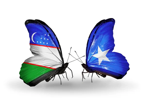 Vlinders met Oezbekistan en Somalië vlaggen — Stockfoto