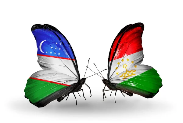 Mariposas con banderas de Uzbekistán y Tayikistán — Foto de Stock