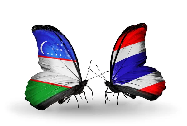 Farfalle con bandiere Uzbekistan e Thailandia — Foto Stock