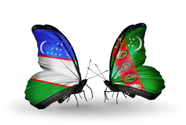 Butterflies with Uzbekistan and Turkmenistan flags — Stock Photo, Image