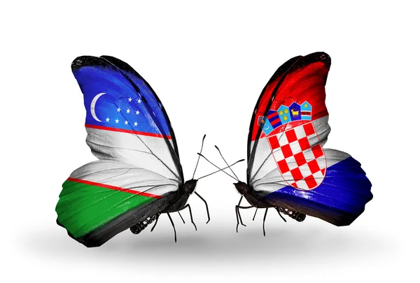 Vlinders met Oezbekistan en Kroatië vlaggen — Stockfoto