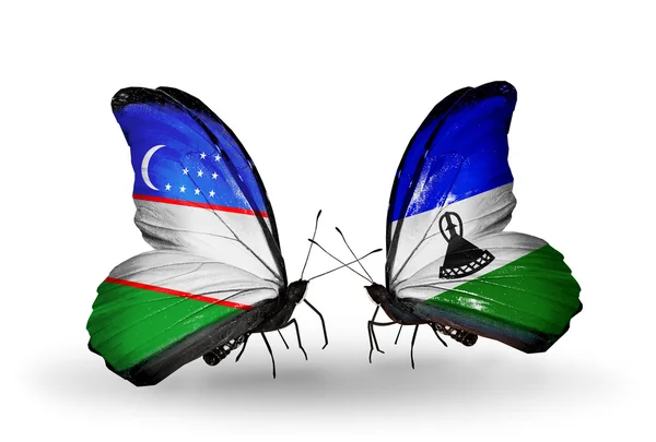 Mariposas con banderas de Uzbekistán y Lesotho —  Fotos de Stock