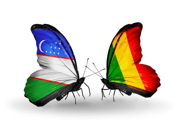 Butterflies with Uzbekistan and Mali flags — Stock Photo, Image