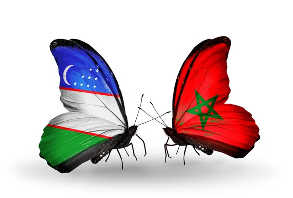 Borboletas com bandeiras do Uzbequistão e Marrocos — Fotografia de Stock