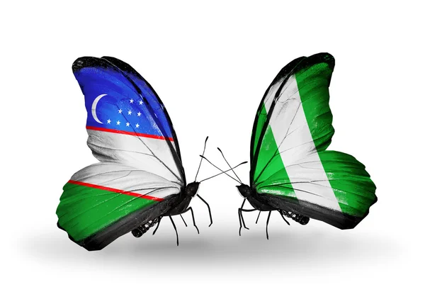 Butterflies with Uzbekistan and Nigeria flags — Stock Photo, Image