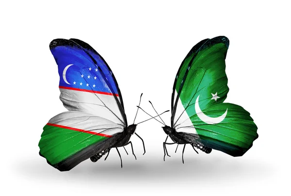 Butterflies with Uzbekistan and Pakistan flags — Stock Photo, Image