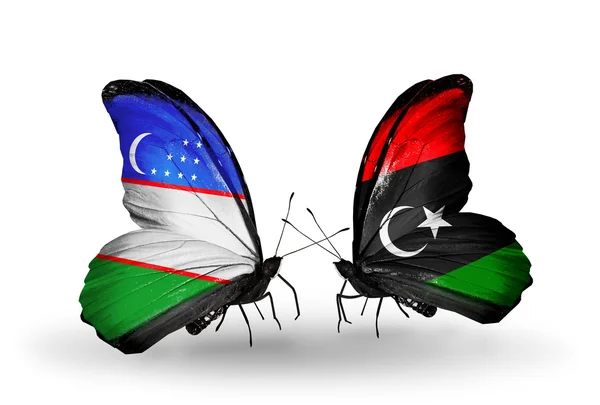 Mariposas con banderas de Uzbekistán y Libia —  Fotos de Stock