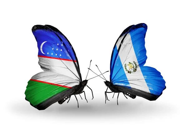 Farfalle con bandiere Uzbekistan e Guatemala — Foto Stock
