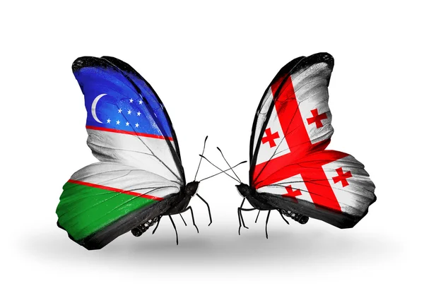 Butterflies with Uzbekistan and Georgia flags — Stock Photo, Image