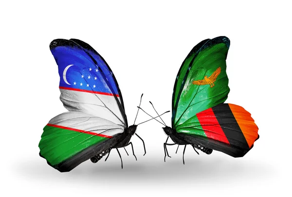 Fjärilar med Uzbekistan och Zambia flaggor — Stockfoto