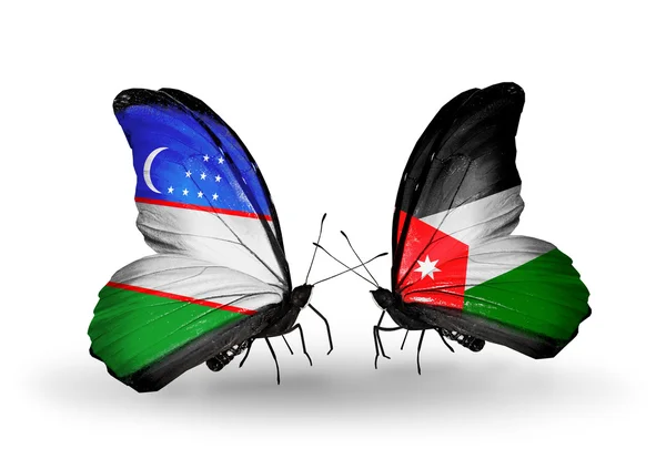 Butterflies with Uzbekistan and  Jordan flags — Stock Photo, Image