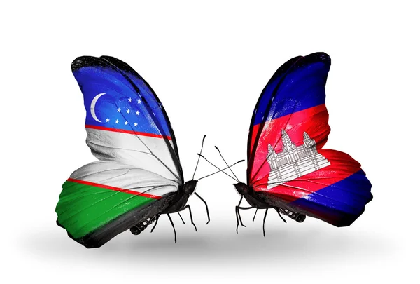 Fjärilar med Uzbekistan och Kambodja flaggor — Stockfoto