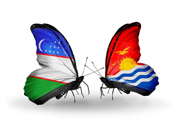 Butterflies with Uzbekistan and Kiribati flags — Stock Photo, Image