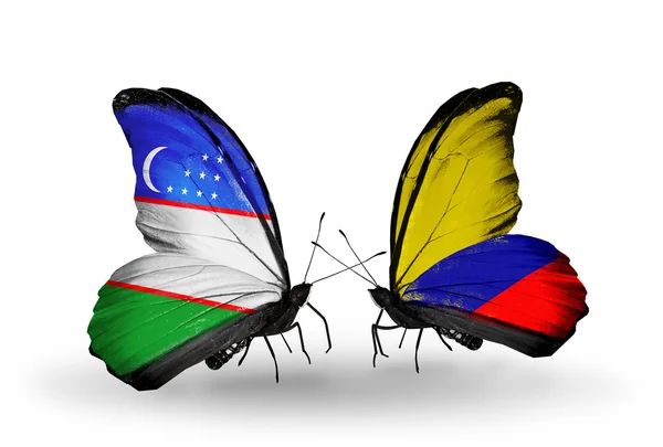 Farfalle con bandiere Uzbekistan e Columbia — Foto Stock