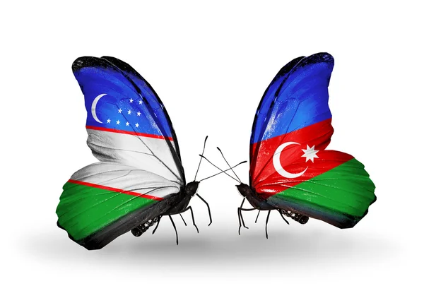 Fjärilar med Uzbekistan och Azerbajdzjan flaggor — Stockfoto
