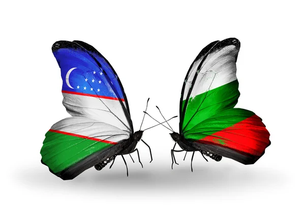 ウズベキスタン、ブルガリアのフラグと蝶 — ストック写真