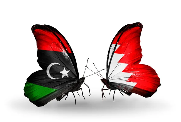 Butterflies with Libya and Bahrain flags — Stock Photo, Image