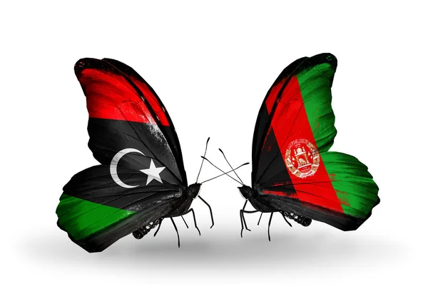Бабочки с флагами Ливии и Афганистана — стоковое фото