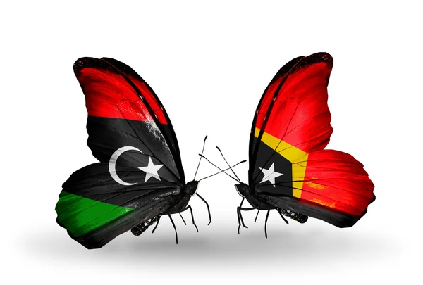 Fjärilar med Libyen och Östtimor flaggor — Stockfoto