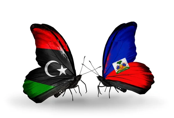 Butterflies with Libya and  Haiti flags — Stock Photo, Image