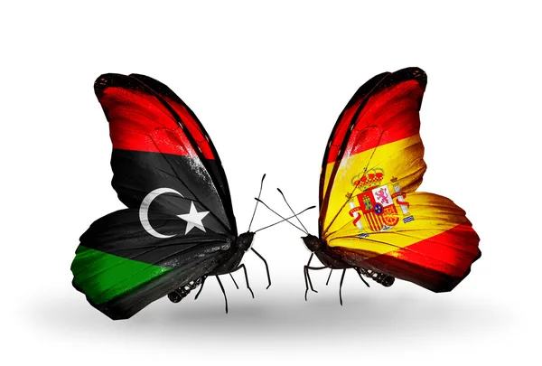 Butterflies with Libya and Spain flags — Stock Photo, Image