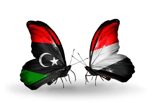 Butterflies with Libya and Yemen flags — Stock Photo, Image