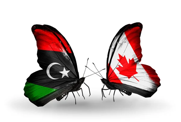 Butterflies with  Libya and Canada flags — Stock Photo, Image
