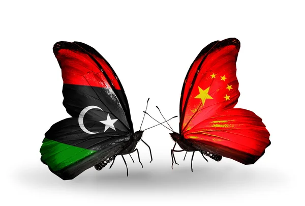 Schmetterlinge mit libyschen und chinesischen Flaggen — Stockfoto