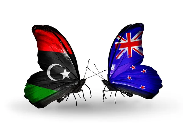 Fjärilar med Libyen och Nya Zeeland flaggor — Stockfoto