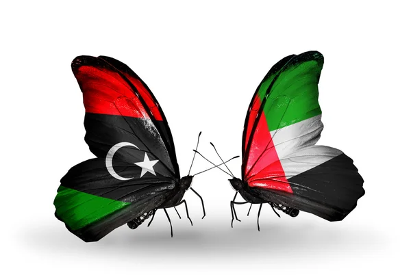 Butterflies with Libya and UAE flags — Stock Photo, Image