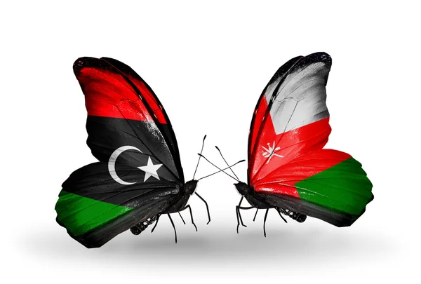 Butterflies with Libya and Oman flags — Stock Photo, Image