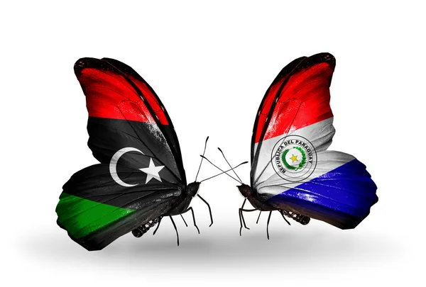 Butterflies with Libya and Paraguay flags — Stock Photo, Image