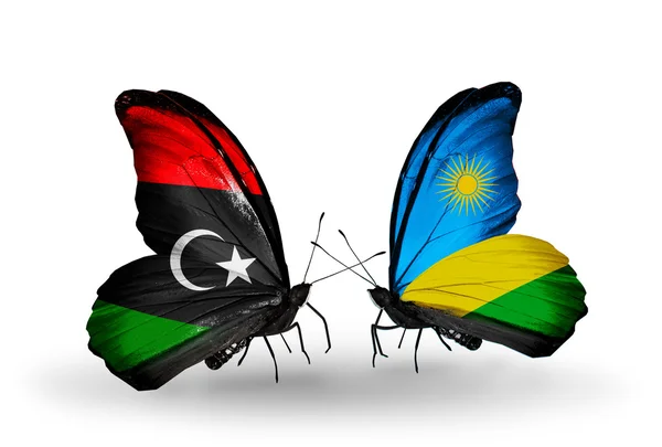 Butterflies with Libya and Rwanda flags — Stock Photo, Image