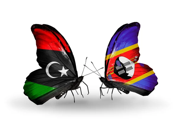 लीबिया और स्वाजीलैंड ध्वज के साथ तितली — स्टॉक फ़ोटो, इमेज