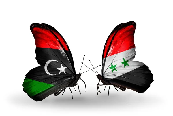 Butterflies with Libya and Syria flags — Stock Photo, Image