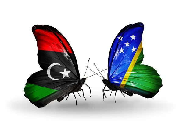 Schmetterlinge mit libyschen und salomonischen Flaggen — Stockfoto