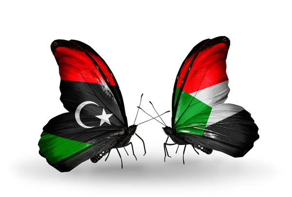 Butterflies with Libya and Sudan flags — Stock Photo, Image