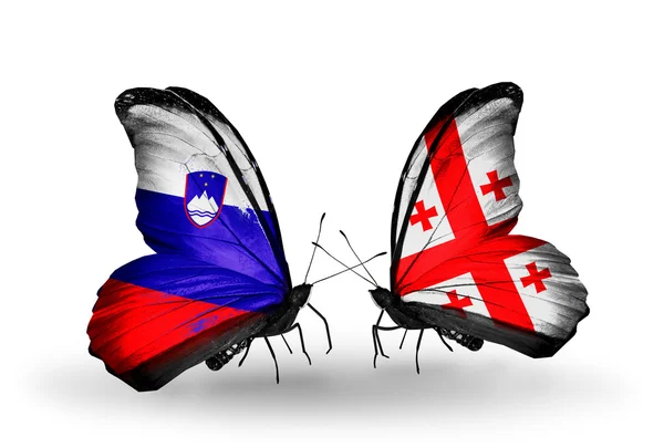 Kelebekler Slovenya ve Gürcistan bayraklı — Stok fotoğraf