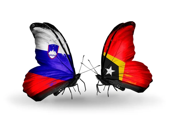 Butterflies with Slovenia and East Timor flags — Stock Photo, Image