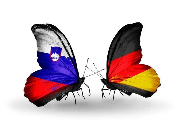 Butterflies with Slovenia and Germany flags — Stock Photo, Image