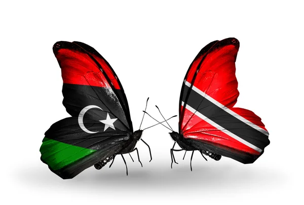 Butterflies with Libya and Trinidad and Tobago flags — Stock Photo, Image
