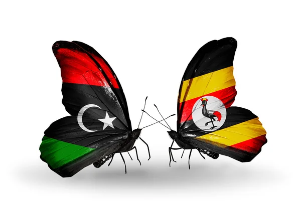 Vlinders met Libië en Oeganda vlaggen — Stockfoto