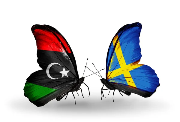 Libya ve İsveç bayraklarını kelebekler — Stok fotoğraf