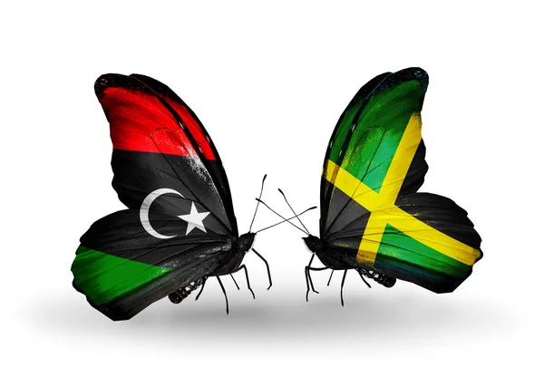 Schmetterlinge mit libyschen und jamaikanischen Fahnen — Stockfoto