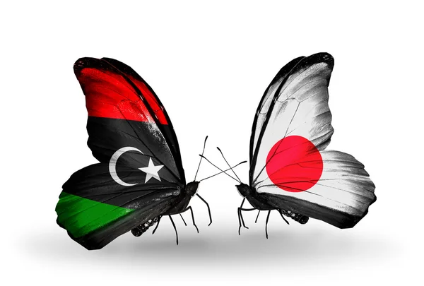 Butterflies with Libya and Japan flags — Stock Photo, Image