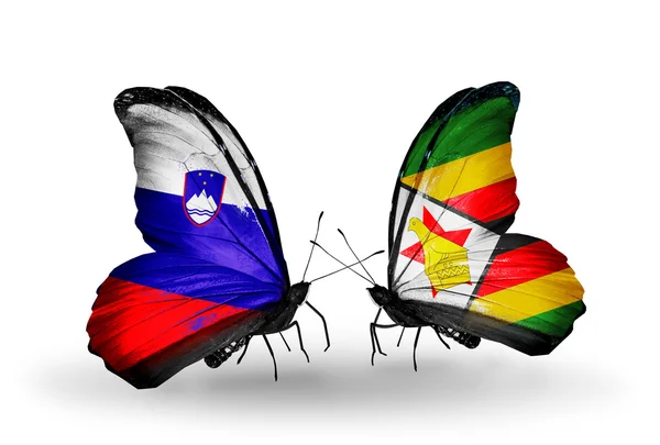 Butterflies with Slovenia and Zimbabwe flags — Stock Photo, Image